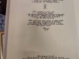a book with a poem on it sitting on a table