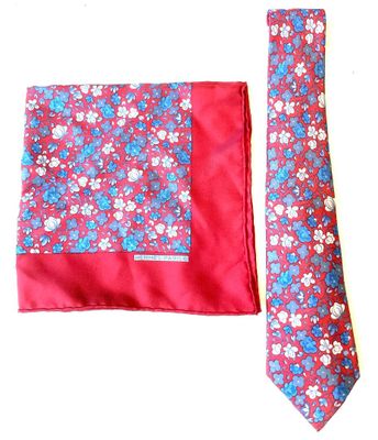 a tie and a pocket square on a white background
