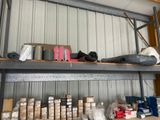 many rolls of tape on a shelf in a storage room