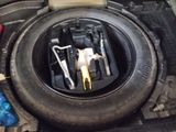 a tire that has a bunch of tools in it