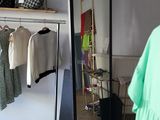 a woman standing in front of a mirror in a room