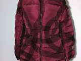 the jacket is red and black and has a hood on it