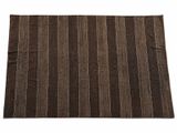 a brown and white striped rug on a white background