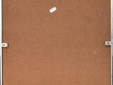 a brown piece of luggage sitting on top of a wooden floor