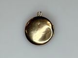 a gold locke on a white surface with a white background