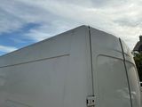 a white van that is parked in a lot
