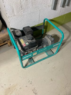 a small green cart with tools on it in a garage