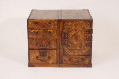an old wooden chest with drawers and drawers on it
