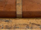 a close up of a piece of wood with writing on it
