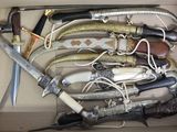 a lot of different types of knives in a box