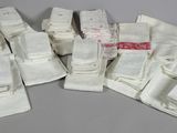 a pile of white towels on a gray surface