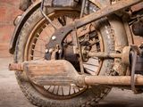 an old motorcycle that is parked in a garage