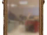 an image of a gold framed mirror on a white background
