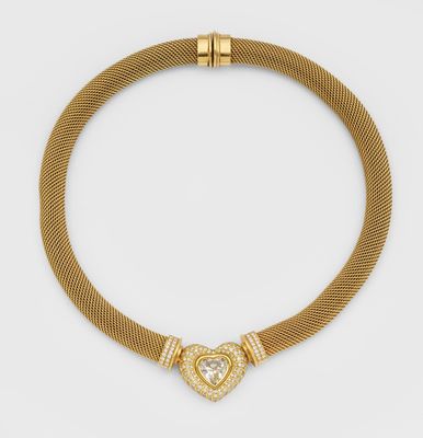 un collier en forme de cœur en or et diamants, signé Cartier