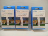 three boxes of security keypads sitting on top of a table