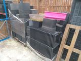 a pile of black and pink boxes sitting next to each other