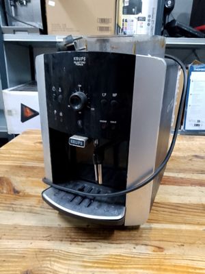 a coffee machine that is sitting on a wooden table