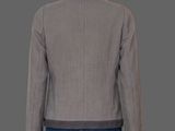 the back view of a woman ' s jacket with a black and white checkered pattern