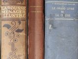 several old books are sitting on a shelf in a book case