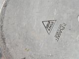 a metal pan with a lid that has a sticker on it