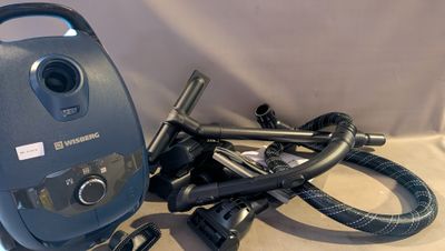 an image of a vacuum cleaner and other items on a table