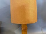 a lamp that is sitting on a table next to a lamp