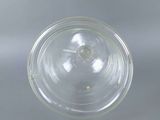 a close up of a clear glass cup on a table