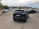 many cars parked in a parking lot in a parking lot