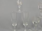 several different types of wine glasses and glasses on a table