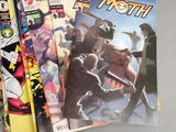 a lot of comic books sitting on a table