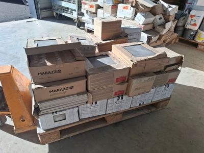 a pile of boxes sitting on a pallet in a warehouse