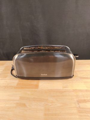 Grille-pain TEFAL TL520810 La poignée ne tient pas Traces d'…