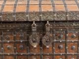 a wooden chest with a metal latch on it