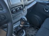 the interior of a car with a steering wheel and dashboard controls