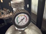 a pressure gauge sitting on top of a propanent