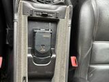an image of a car dashboard with a cell phone in the center of it