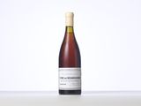 a bottle of wine that is sitting on a table