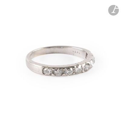 a close up of a diamond ring on a white background
