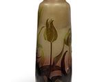 a glass vase with a floral design on it