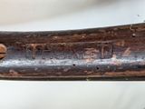 a close up of a baseball bat with a wooden handle