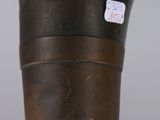 a close up of a vase with a sticker on it