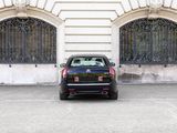 a black car parked in front of a building