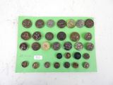 some coins are sitting on a green surface with a price tag