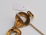 a gold plated necklace with a chain attached to it