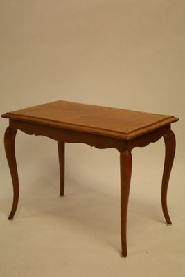 a small table with a wooden top on a white background