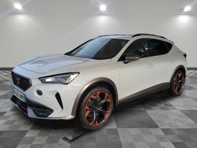 a white suv with orange rims parked on a checkered floor