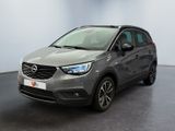 the grey opel suv is parked in a large room