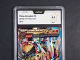 the pokemon card is in a clear plastic holder on a black surface