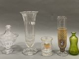 a lot of glass vases that are sitting on a table