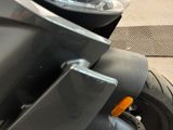 a close up of a motorcycle parked on the street